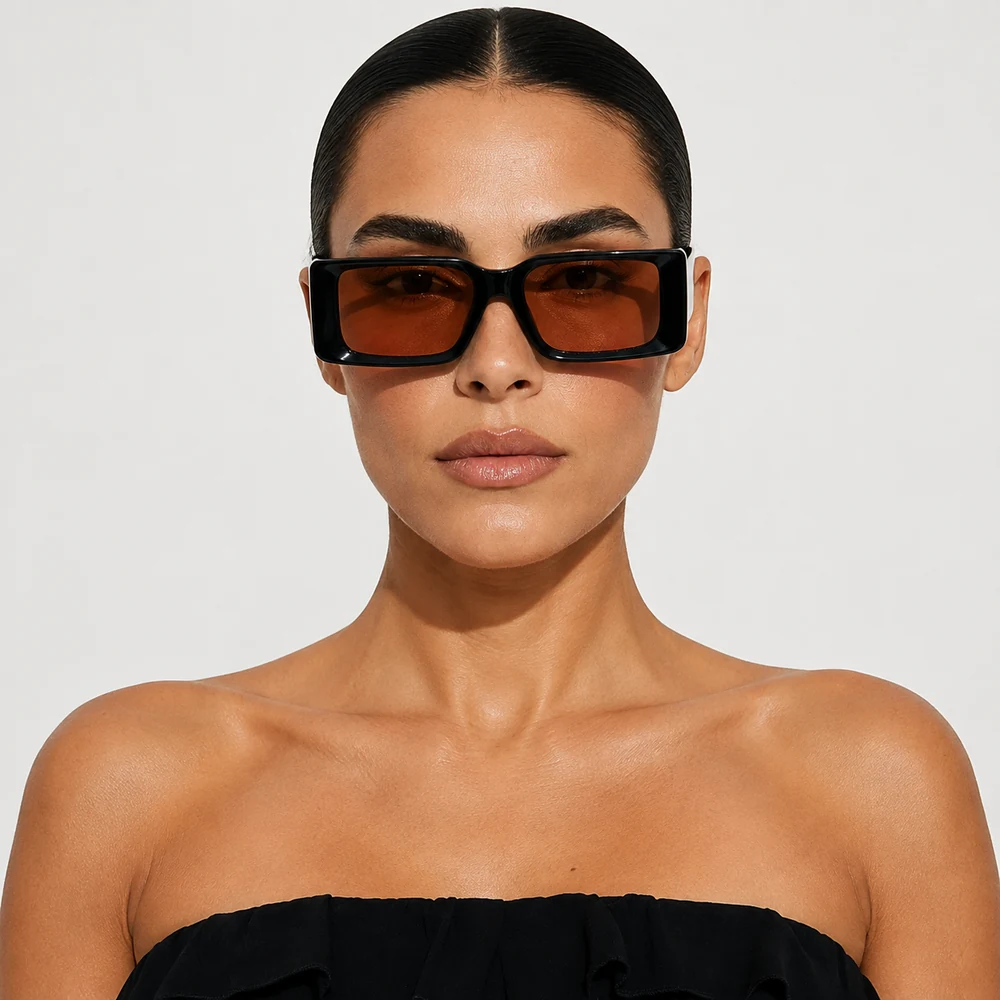Model wearing black square sunglasses with amber lenses