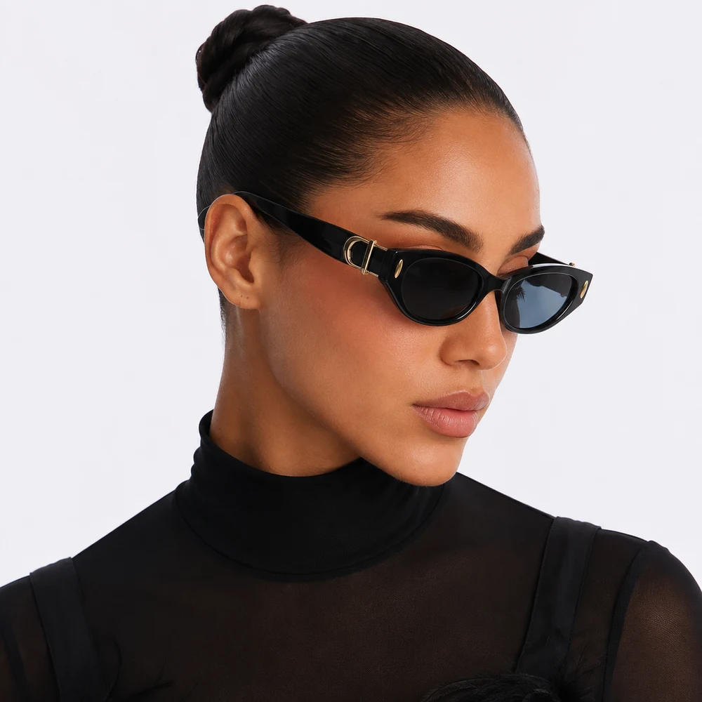 encore-black-narrow-cat-eye-sunglasses-angle-02 Black narrow cat-eye sunglasses with gold-tone temple detail, complete model portrait