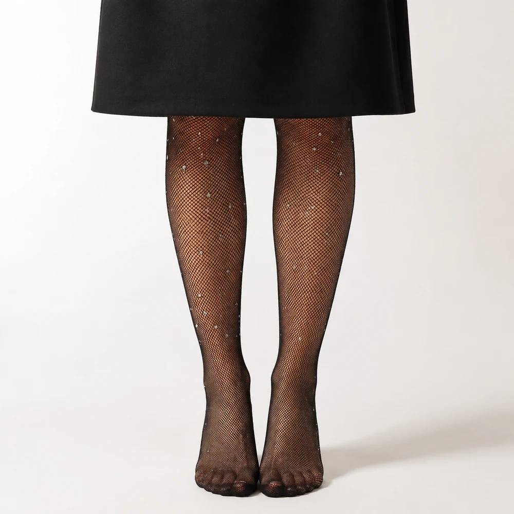 glow-up-black-rhinestone-fishnet-tights-worn-front-01 Black rhinestone fishnet tights worn beneath a black skirt