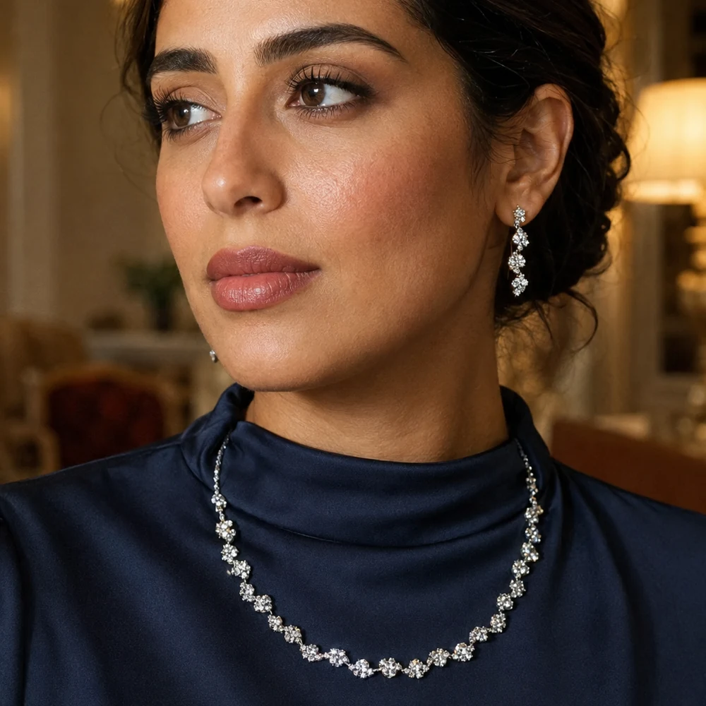 live-for-the-memories-silver-rhinestone-necklace-earring-set-hotel-01 Silver-tone floral rhinestone necklace and drop earring set worn with a black neckline